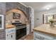 Updated kitchen featuring stainless steel oven, butcher block countertops and white cabinets at 135 Brookshire Dr, Fayetteville, GA 30215