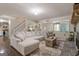 Bright living room featuring a sectional sofa, hardwood floors, and staircase with a white railing at 135 Brookshire Dr, Fayetteville, GA 30215