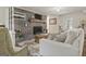 Bright living room with a brick fireplace, comfortable seating, and ample natural light at 135 Brookshire Dr, Fayetteville, GA 30215