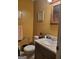 Bathroom features a sink with a vanity, toilet, mirror, and neutral wall color at 106 Garden Trl, Stockbridge, GA 30281