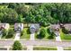 Aerial view showcasing a well-maintained home with lush landscaping at 149 Pristine Dr, Locust Grove, GA 30248