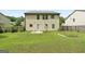 Large backyard with lawn and concrete patio, surrounded by wood fence at 149 Pristine Dr, Locust Grove, GA 30248