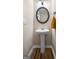 Pedestal sink, decorative mirror, and modern lighting in a half bathroom at 149 Pristine Dr, Locust Grove, GA 30248