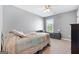 Cozy bedroom featuring carpet floors and a bright window at 149 Pristine Dr, Locust Grove, GA 30248