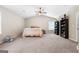 Bright and spacious carpeted bedroom with ceiling fan at 149 Pristine Dr, Locust Grove, GA 30248