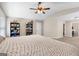 Large bedroom features a vaulted ceiling and access to an ensuite bathroom at 149 Pristine Dr, Locust Grove, GA 30248
