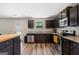 Modern kitchen equipped with stainless steel appliances and dark wood cabinetry at 149 Pristine Dr, Locust Grove, GA 30248