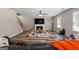Bright living room with fireplace, wood flooring and staircase access at 149 Pristine Dr, Locust Grove, GA 30248