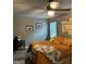 Comfortable bedroom featuring a ceiling fan, neutral walls, and a cozy, patterned blanket on the bed at 175 Bridgemill Dr, Covington, GA 30014