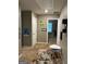 Welcoming hallway with neutral walls, plush carpet, and eclectic artwork leads to various rooms at 175 Bridgemill Dr, Covington, GA 30014