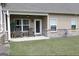 Inviting covered porch overlooking green lawn, complete with rocking chairs and ceiling fan at 2845 Long Shadow Ct, Snellville, GA 30078