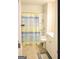 Bathroom featuring a shower and bath combination with a patterned shower curtain at 2845 Long Shadow Ct, Snellville, GA 30078