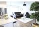 Open living space featuring modern furnishings, hardwood floors, and a stylish chandelier at 2845 Long Shadow Ct, Snellville, GA 30078