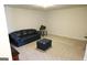 Spacious living room is complete with carpet floors, large couch, and recessed lighting at 2845 Long Shadow Ct, Snellville, GA 30078