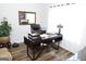 Well-lit office with wood floors, decorative light fixture, and plenty of desk space at 2845 Long Shadow Ct, Snellville, GA 30078