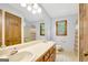 Bright bathroom with double vanity, large mirror, and colorful shower curtain at 9706 Holly Hill Way, Jonesboro, GA 30238