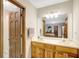 Bathroom with double sinks, a shower and wood cabinets at 9706 Holly Hill Way, Jonesboro, GA 30238
