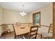 Cozy dining room with wood table, chandelier and natural lighting at 9706 Holly Hill Way, Jonesboro, GA 30238
