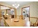 Dining room with wood table and views to the living room and kitchen at 9706 Holly Hill Way, Jonesboro, GA 30238