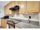This well-equipped kitchen boasts sleek appliances and ample counter space at 9706 Holly Hill Way, Jonesboro, GA 30238