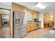 Spacious kitchen with stainless steel appliances and seamless access to dining room at 9706 Holly Hill Way, Jonesboro, GA 30238
