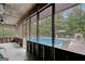 Screened-in porch overlooking the sparkling inground pool at 9706 Holly Hill Way, Jonesboro, GA 30238