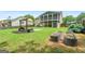 Expansive backyard featuring a cozy fire pit, raised garden beds, and a screened-in porch perfect for outdoor living at 341 Jodeco Station E Cir, Stockbridge, GA 30281