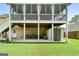 View of the backyard under screened in porch with patio furniture, bicycle and storage at 341 Jodeco Station E Cir, Stockbridge, GA 30281