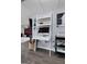 Basement with a white ladder shelf as desk, decorations, and grey walls at 341 Jodeco Station E Cir, Stockbridge, GA 30281