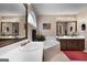 The bathroom features double sinks, a soaking tub, and an arched window at 341 Jodeco Station E Cir, Stockbridge, GA 30281