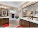 A charming bathroom features double sinks, a soaking tub, and an arched window at 341 Jodeco Station E Cir, Stockbridge, GA 30281