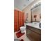 The bathroom features a single sink, toilet, and a shower with a plaid curtain at 341 Jodeco Station E Cir, Stockbridge, GA 30281