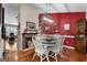 Cozy dining area featuring a fireplace, wood floors, and a stylish light fixture at 341 Jodeco Station E Cir, Stockbridge, GA 30281