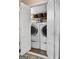 Well-lit laundry closet featuring a stacked washer and dryer at 341 Jodeco Station E Cir, Stockbridge, GA 30281