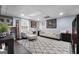 A finished basement has a cozy living room area with carpet and a window at 341 Jodeco Station E Cir, Stockbridge, GA 30281