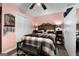 Cozy bedroom features a wooden headboard, and a walk-in closet at 341 Jodeco Station E Cir, Stockbridge, GA 30281