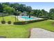 Community swimming pool with lounge chairs and a covered pavilion, perfect for relaxing and enjoying the outdoors at 341 Jodeco Station E Cir, Stockbridge, GA 30281