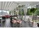 Screened-in porch with wood floors, ceiling fans, and ample seating for outdoor relaxation at 341 Jodeco Station E Cir, Stockbridge, GA 30281