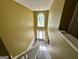 The home's foyer features a staircase and a large arched window for natural light at 4466 Estate St, South Fulton, GA 30349