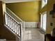 Inviting foyer showcasing a staircase, wood flooring, and bright, natural light at 4466 Estate St, South Fulton, GA 30349