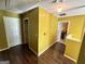 Hallway with hardwood floors, white doors and neutral wall colors at 4466 Estate St, South Fulton, GA 30349