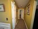 Hallway featuring hardwood floors, white doors and neutral wall colors at 4466 Estate St, South Fulton, GA 30349