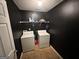 The laundry room features a washer, dryer, and storage shelving at 4466 Estate St, South Fulton, GA 30349