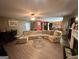 Spacious living room with hardwood floors, a ceiling fan and large windows at 4466 Estate St, South Fulton, GA 30349