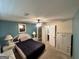 Cozy bedroom with a ceiling fan, a walk-in closet, and ensuite bathroom at 4466 Estate St, South Fulton, GA 30349