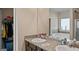 Bright bathroom featuring dual sinks, a soaking tub, and a separate glass-enclosed shower at 697 Emporia Loop, Mcdonough, GA 30253