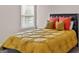 Cozy bedroom features a comfortable bed and a window providing natural light for relaxation at 697 Emporia Loop, Mcdonough, GA 30253