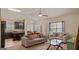 Spacious living room with open floor plan flowing into the dining area and kitchen at 697 Emporia Loop, Mcdonough, GA 30253