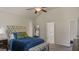 Serene main bedroom featuring a comfortable bed, soft lighting, and a cozy atmosphere at 697 Emporia Loop, Mcdonough, GA 30253