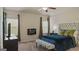 Serene main bedroom featuring a comfortable bed, soft lighting, and a cozy atmosphere at 697 Emporia Loop, Mcdonough, GA 30253